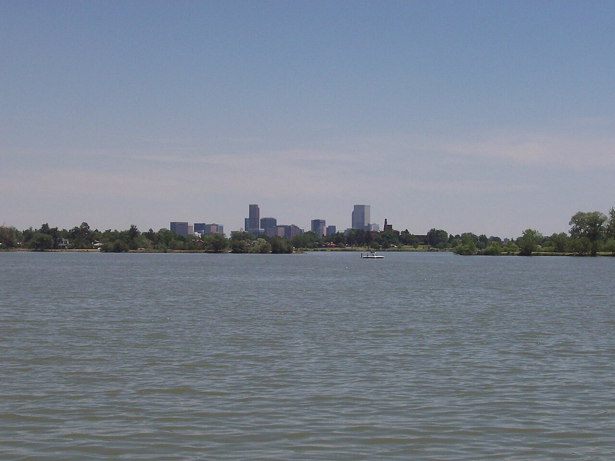 Paddleboarders on Sloan's Lake with mountain views